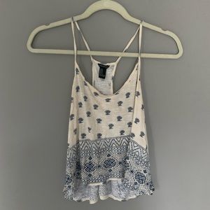 cream and blue colored tank top
